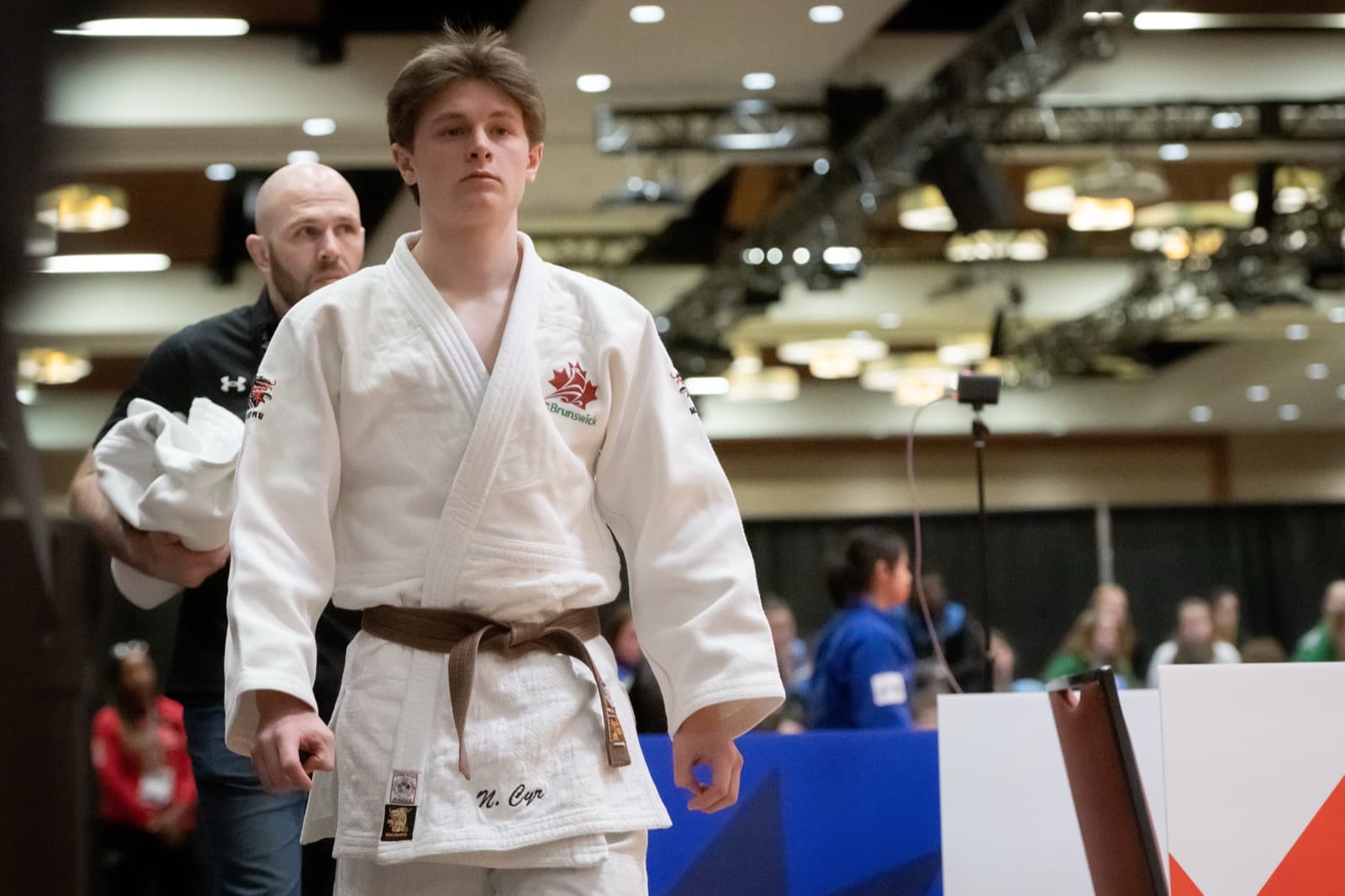 A New Brunswick judoka stepping onto the mat before a match.