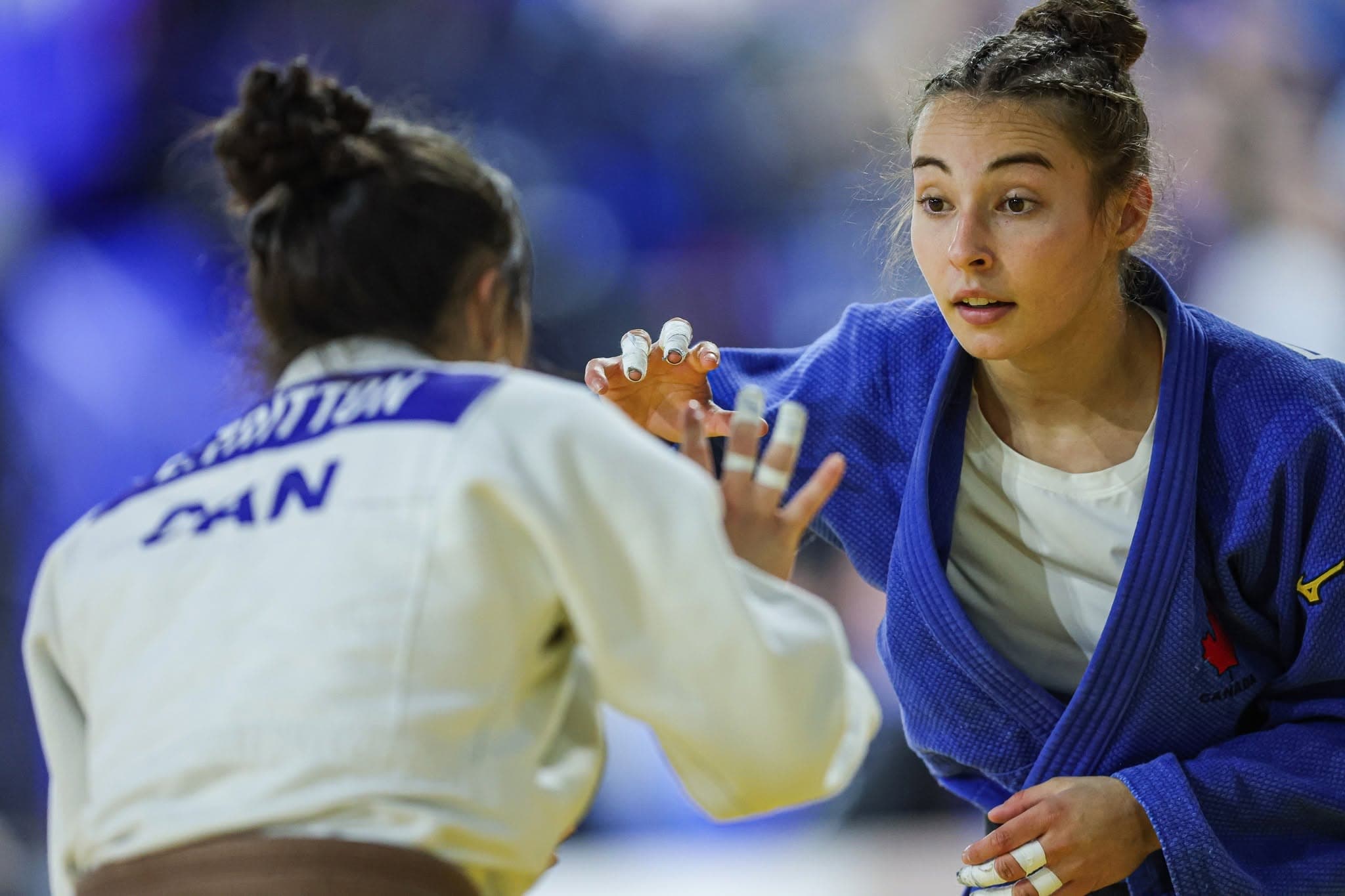 A judoka competing on the mat.